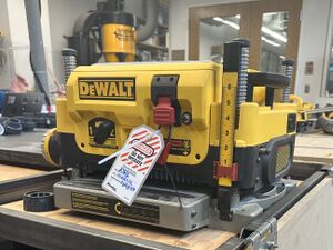 A photo of the DeWalt DW735 planer in the Wood Shop.